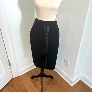 Black BCBG MaxAzria pencil skirt.  Back of skirt laces up black leather.